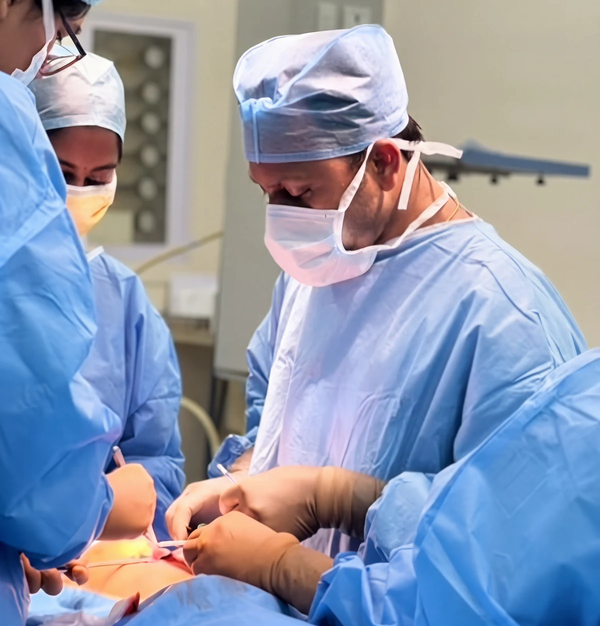 Dr. Raghul M Operating in the Operating Theater